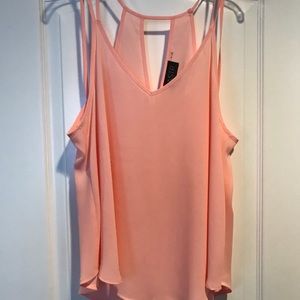 Peach colored tank top with cut outs